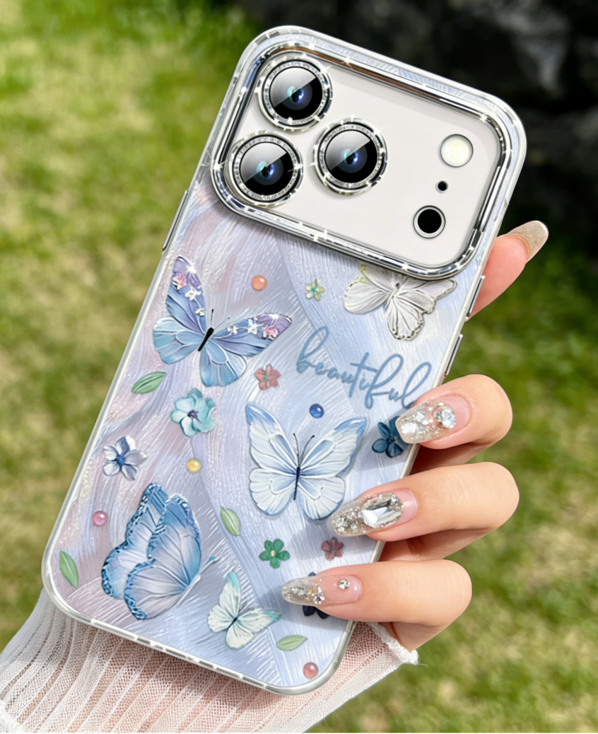 Blue Phone case with butterfly design held by a person outdoors