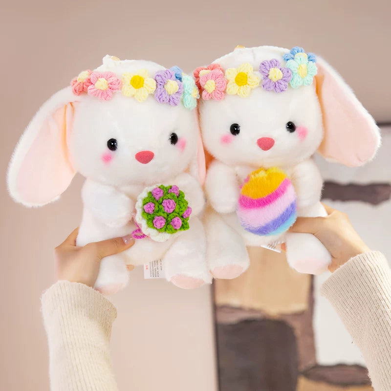 Easter bunny plush toy holding easter eggs and roses