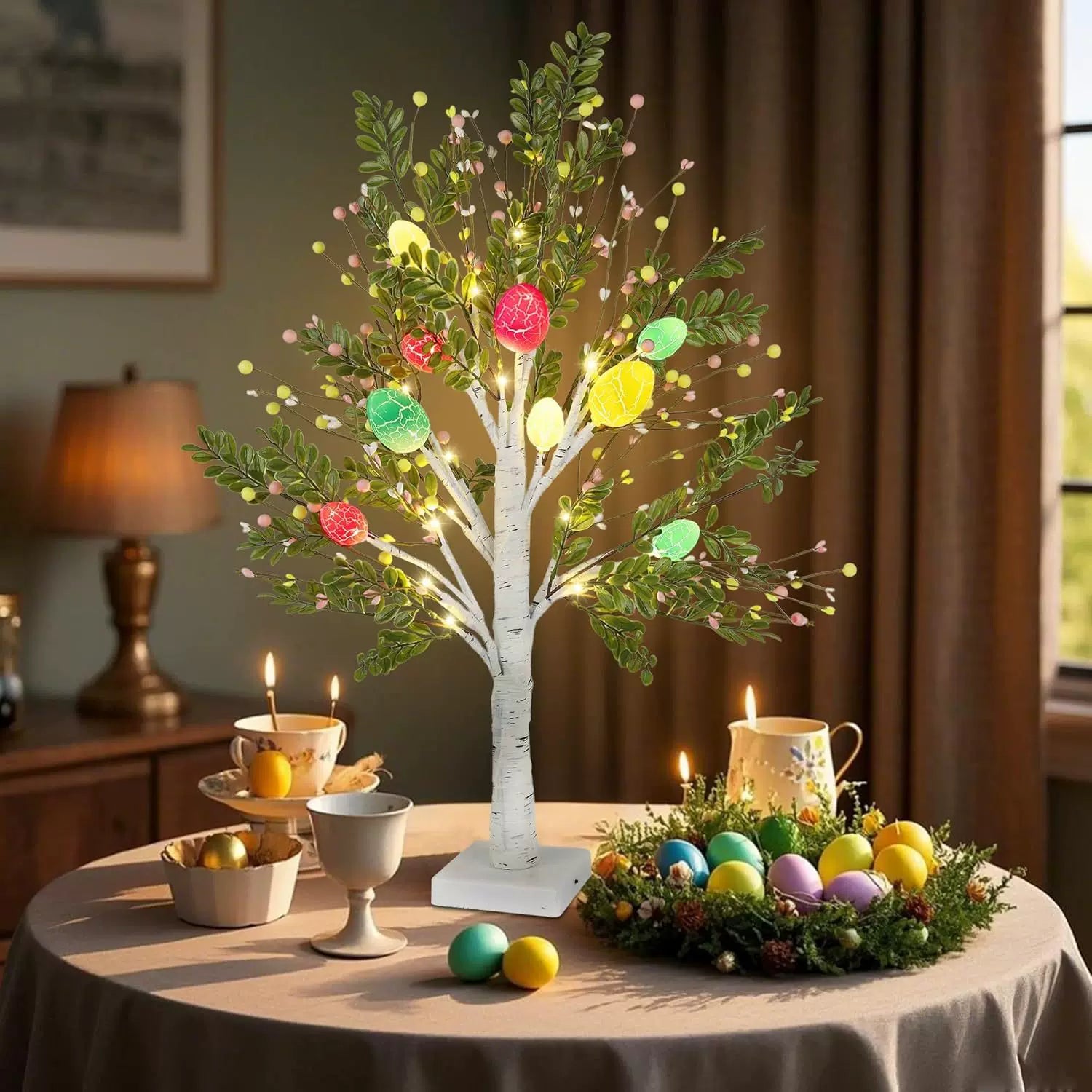 Decorative tree with colorful lights and Easter eggs on a table in a room setting.