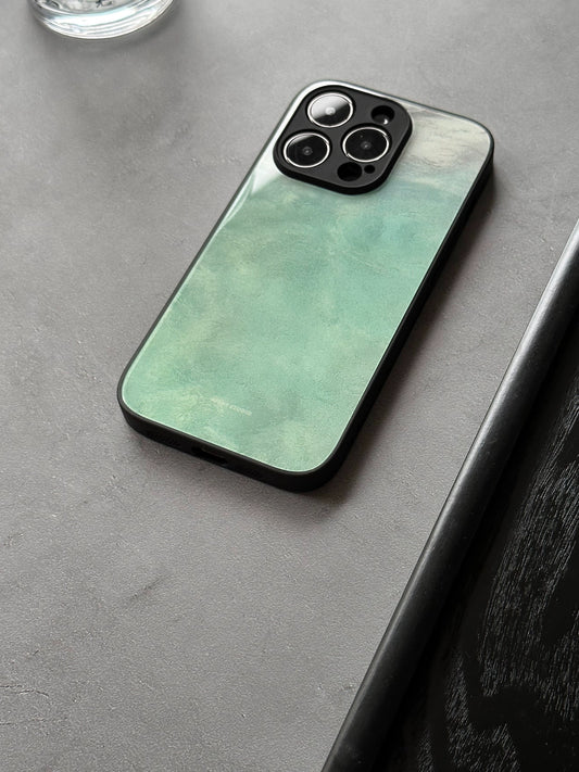 A fluorescent green glass phone case with a sleek design, displayed on a phone.