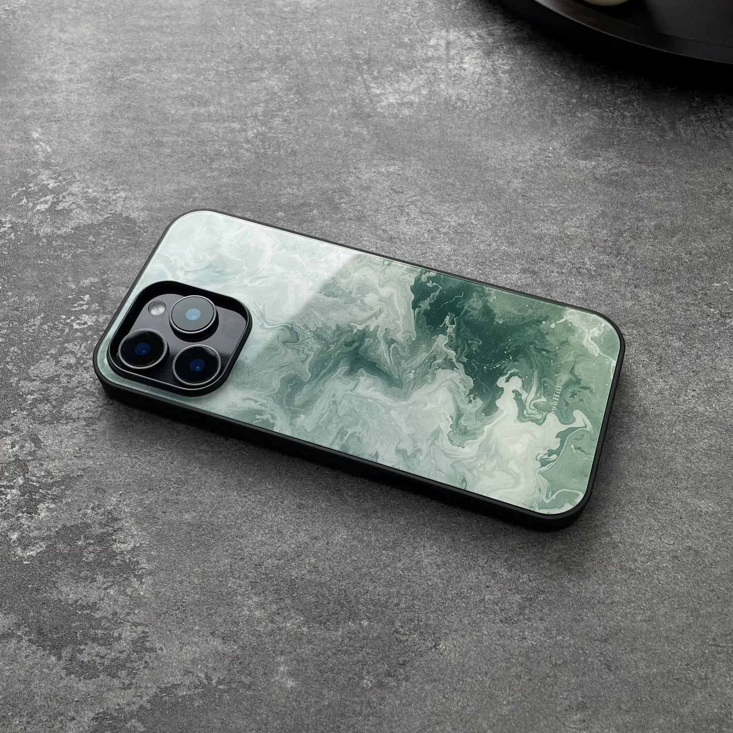 Green wavy pattern anti-slip full-coverage glass phone case with a premium feel.