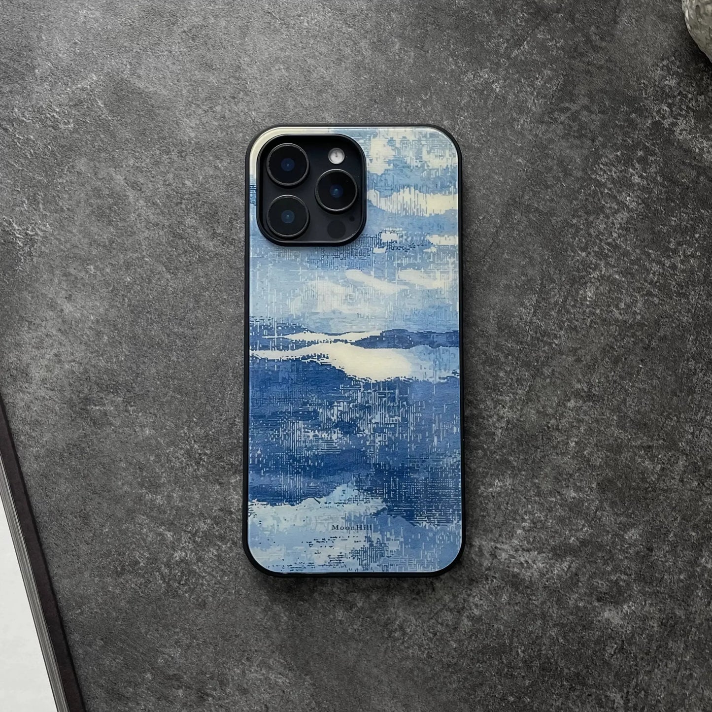 Blue and white, fully enclosed glass phone case with an original, high-end design