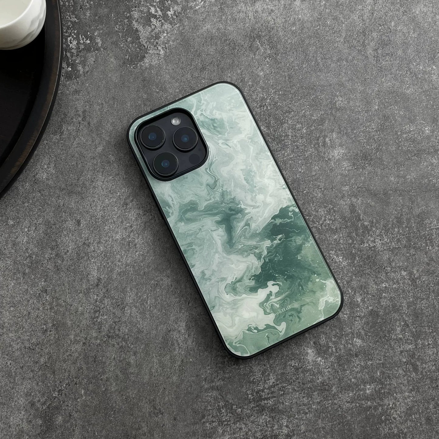 Green wavy pattern anti-slip full-coverage glass phone case with a premium feel.