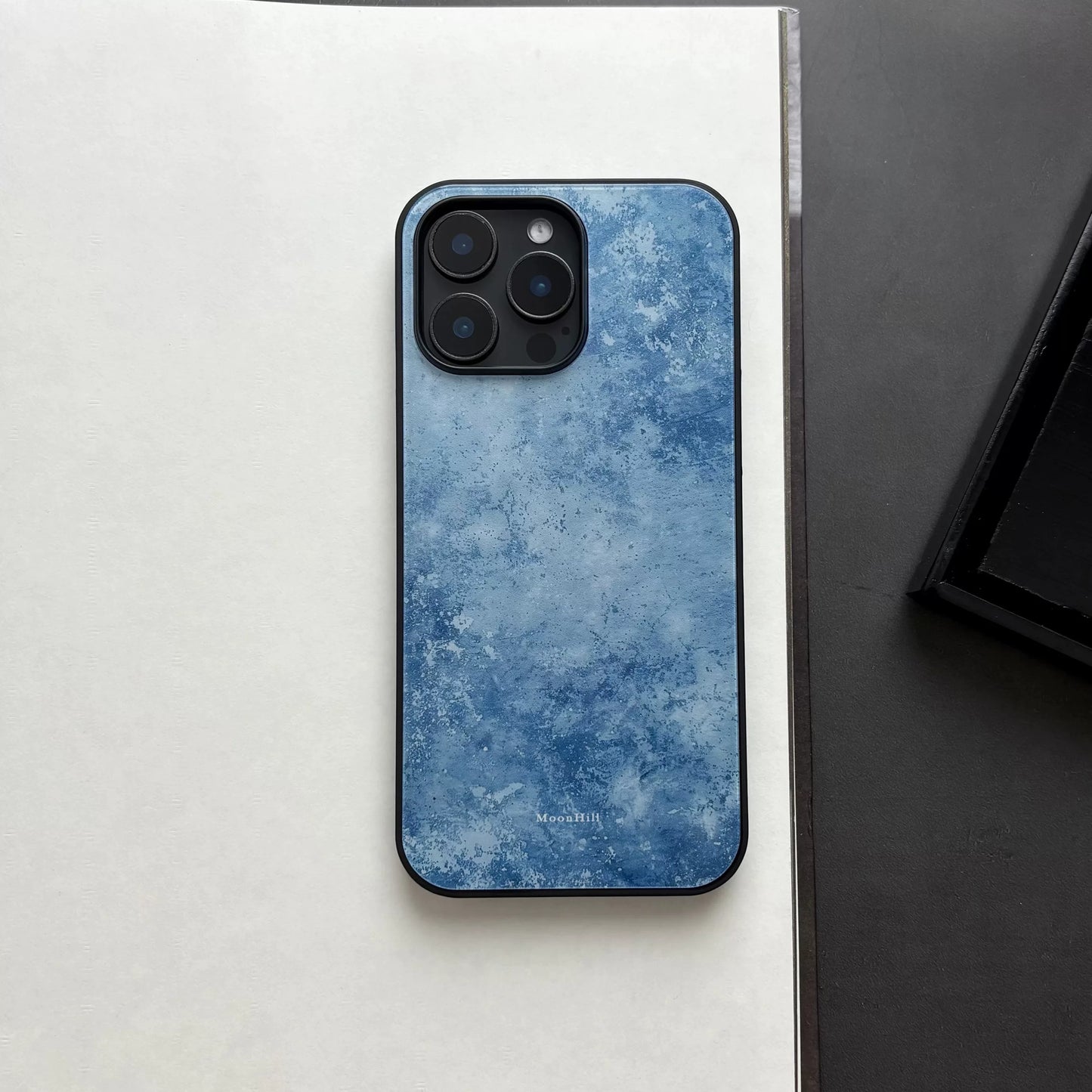 Blue frosted anti-slip full-coverage glass phone case with a premium feel.