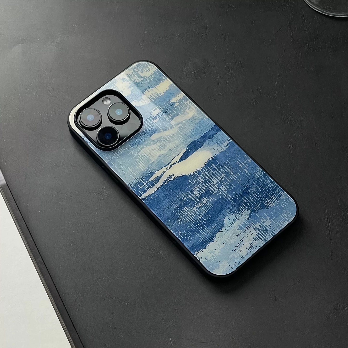 Blue and white, fully enclosed glass phone case with an original, high-end design