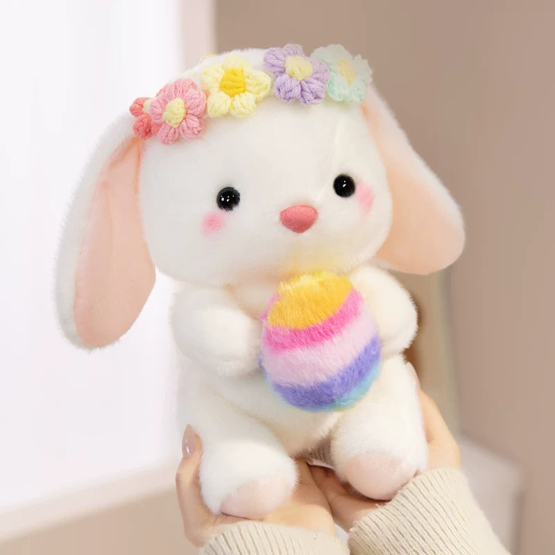 Easter bunny plush toy holding easter eggs and roses