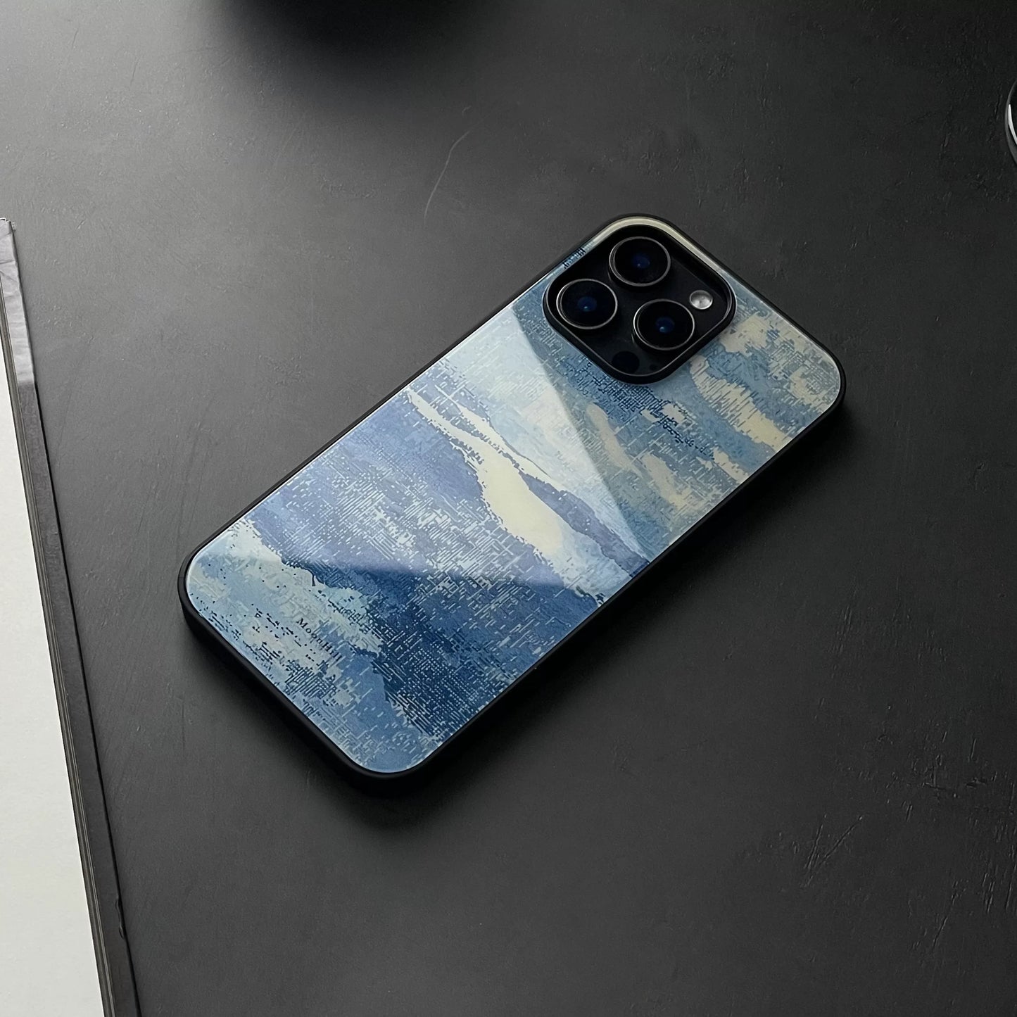 Blue and white, fully enclosed glass phone case with an original, high-end design