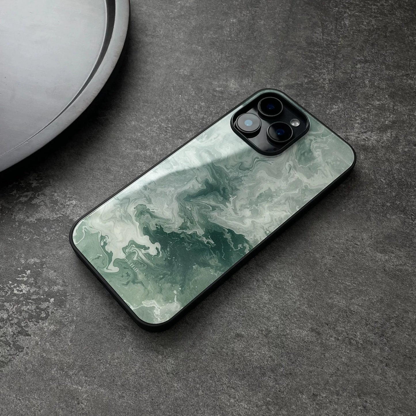 Green wavy pattern anti-slip full-coverage glass phone case with a premium feel.