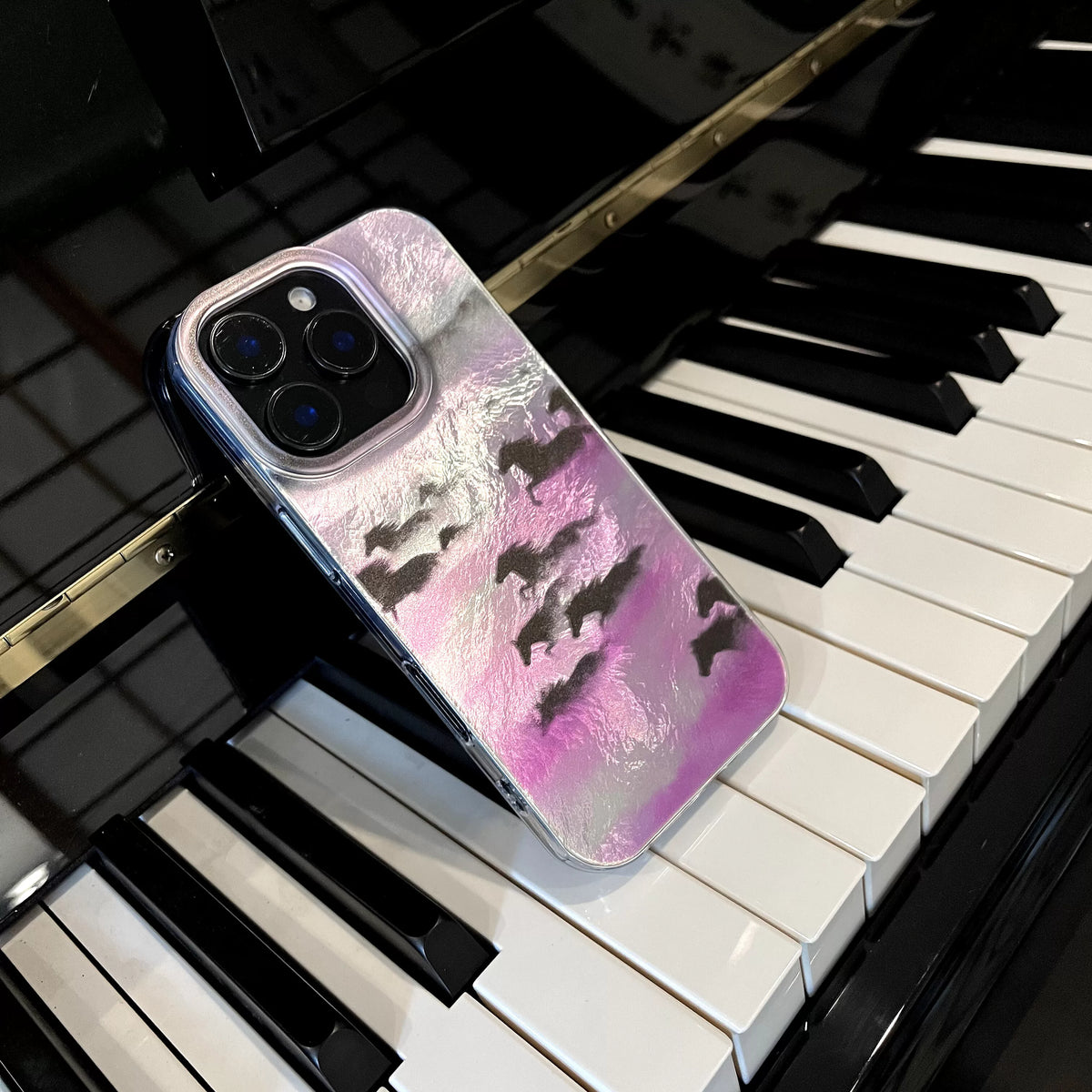 Phone case with abstract design on a piano keyboard