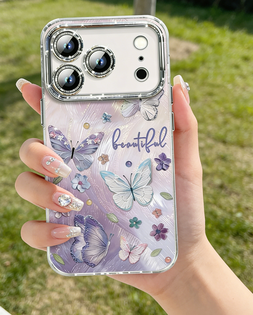 Phone case with butterfly design and 'beautiful' text held by a hand outdoors.