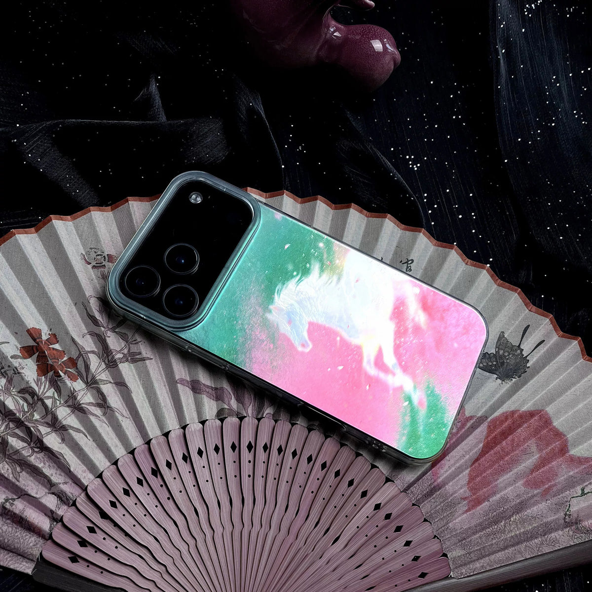 Phone case with colorful design on a fan